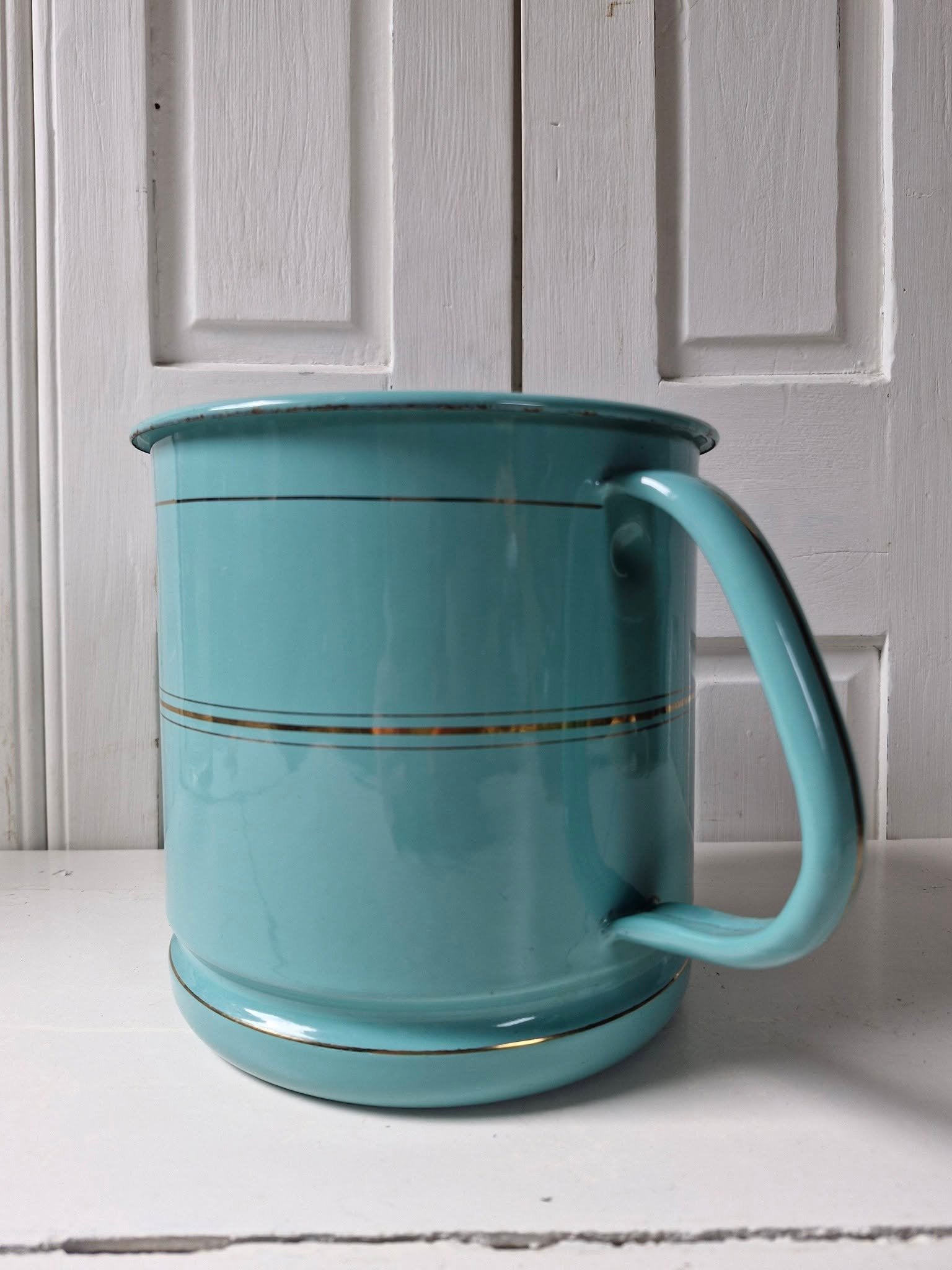 Turquoise emaille melkkoker