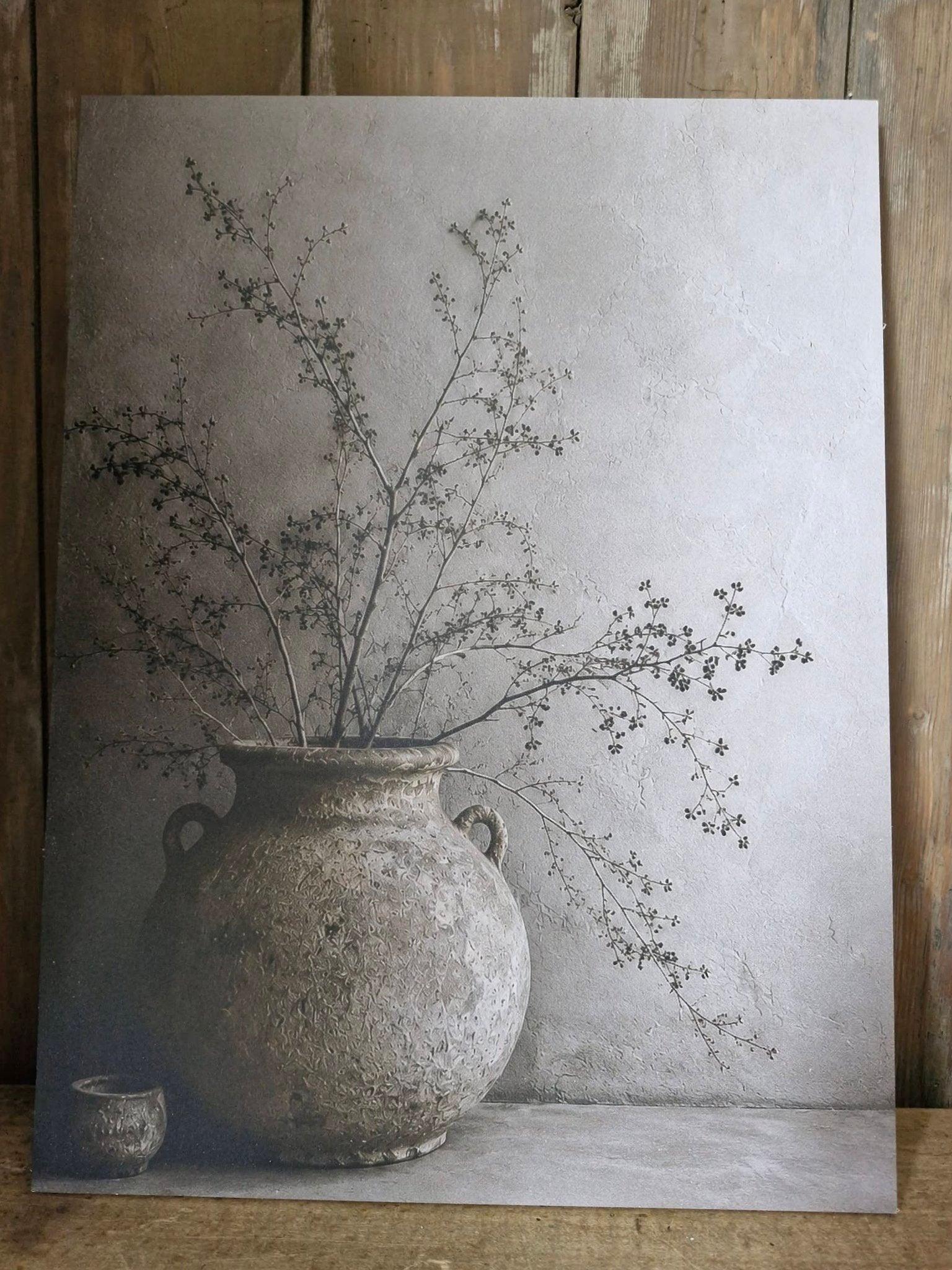 Wandbord. Kruik met carokia