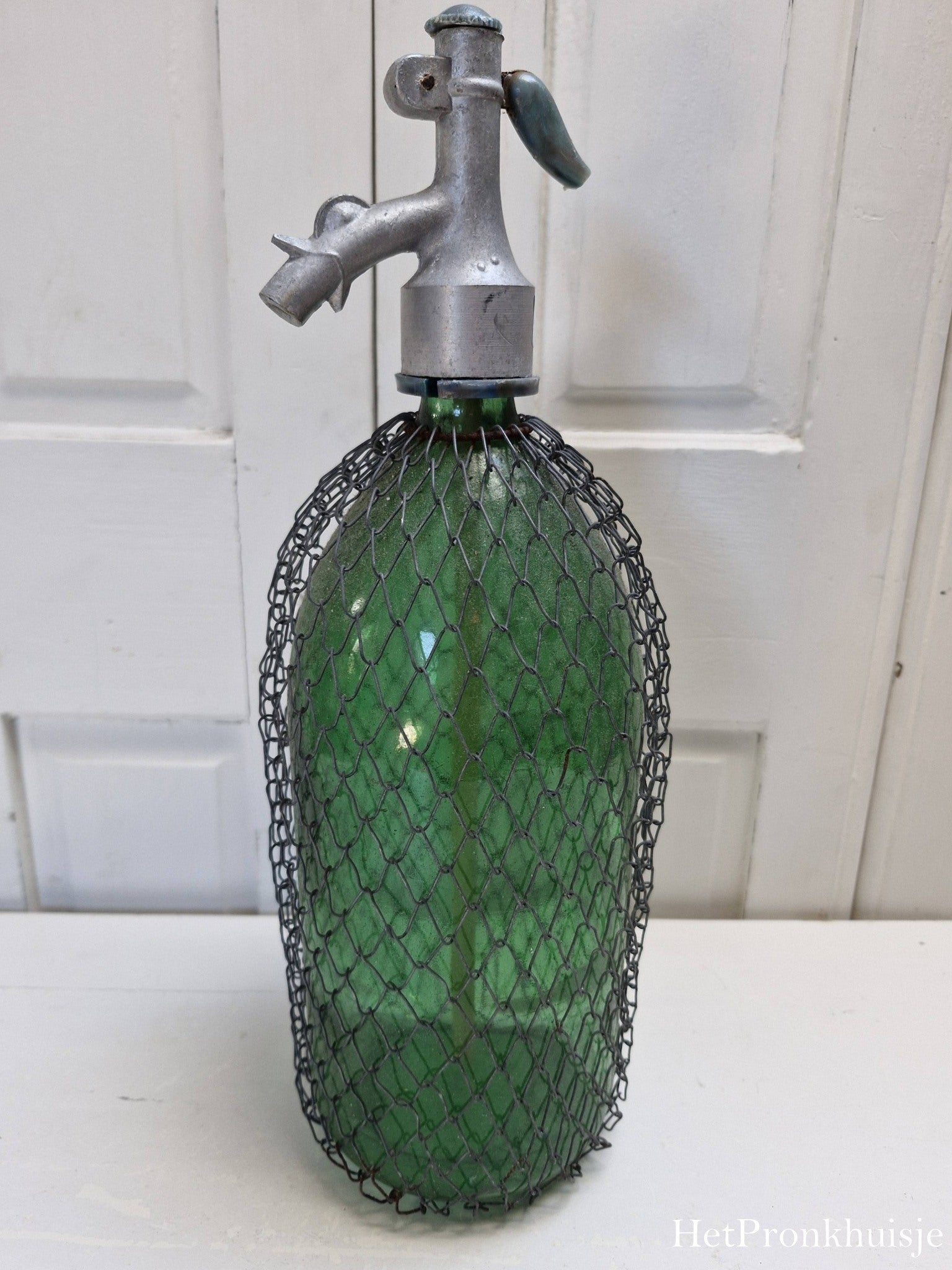 Groene spuitfles met gaas
