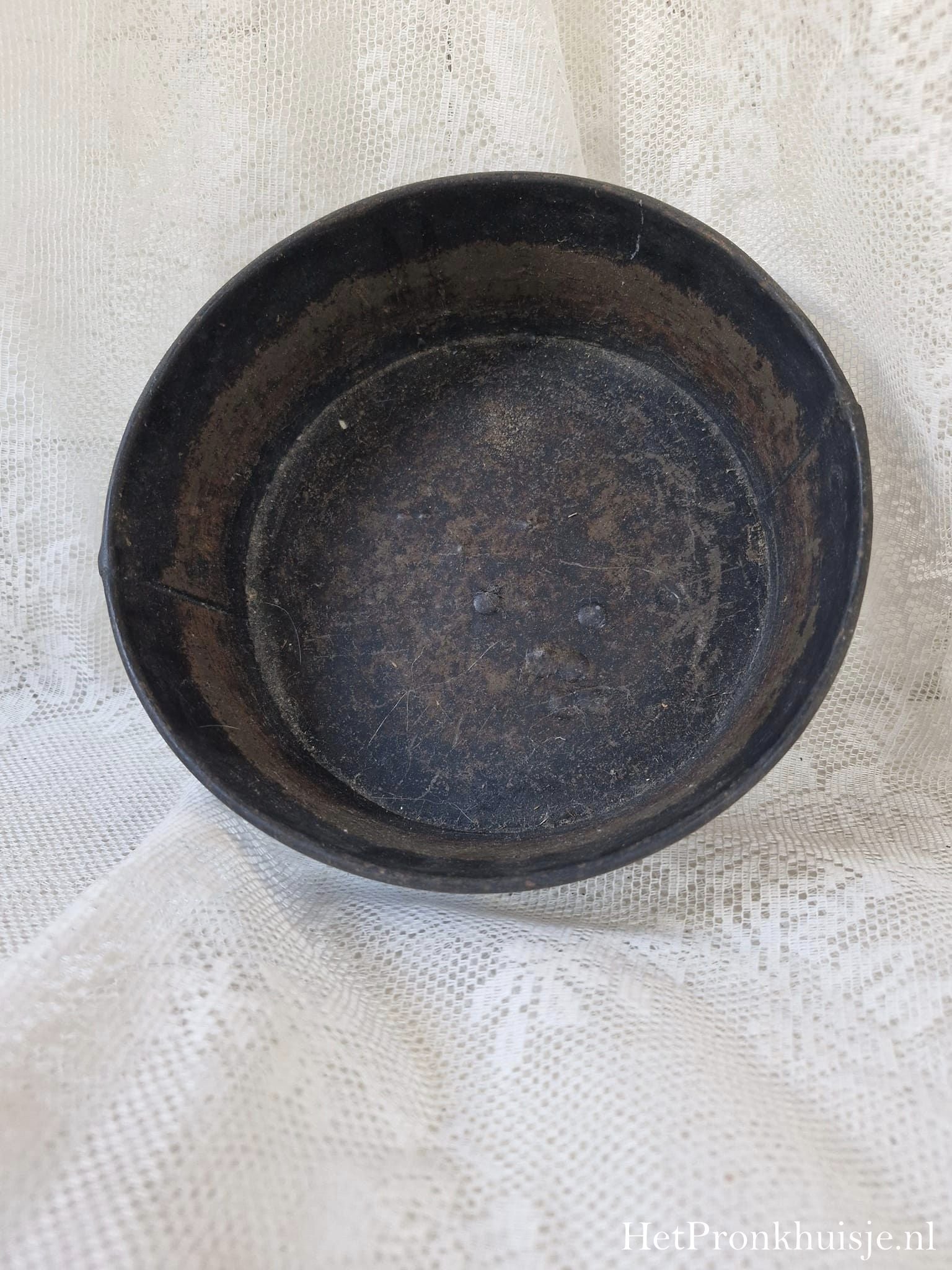 Oud rond bakblik