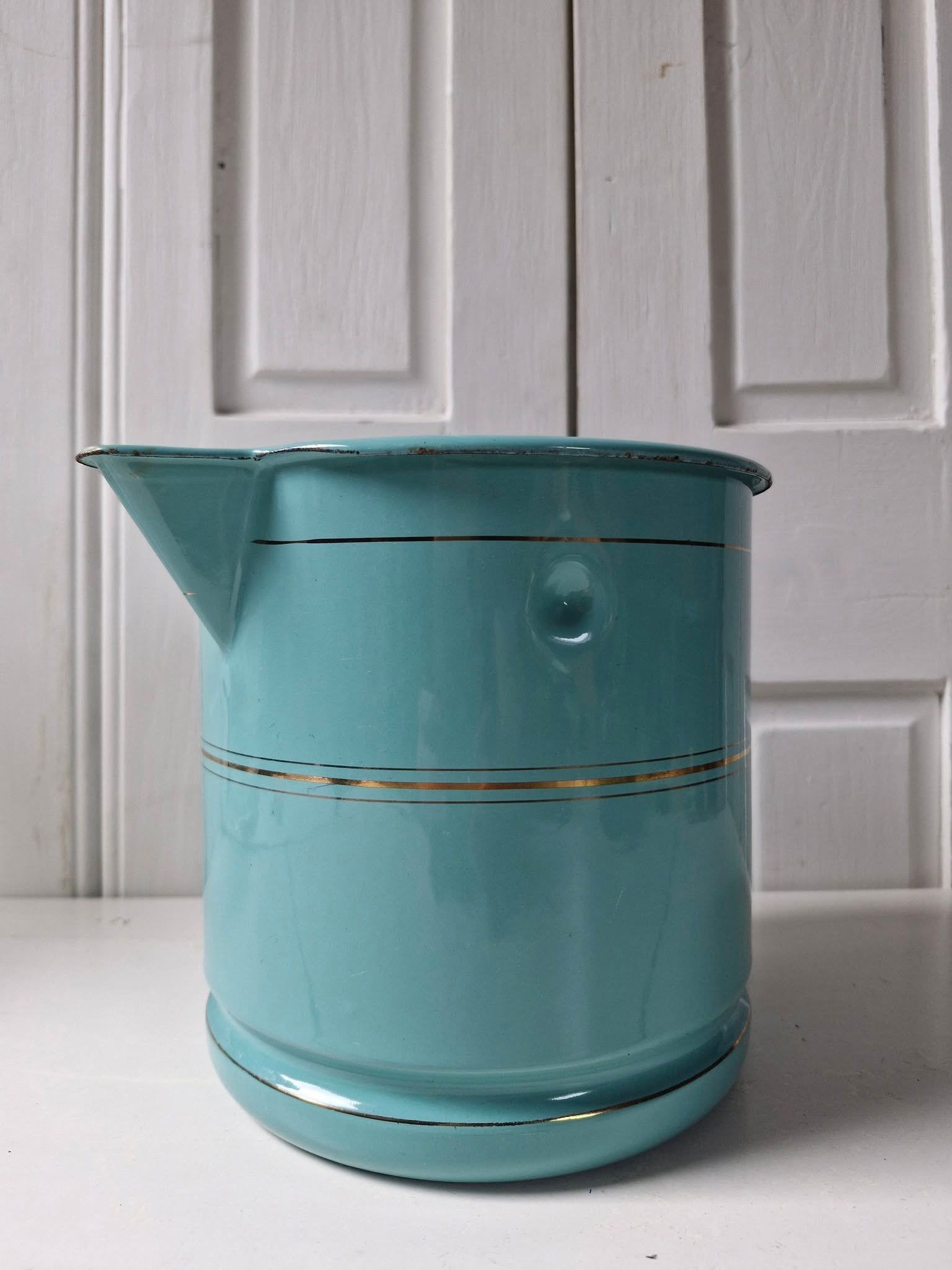 Turquoise emaille melkkoker